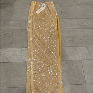 Godiva
Flat Sequin Thigh Split Maxi Skirt in Gold